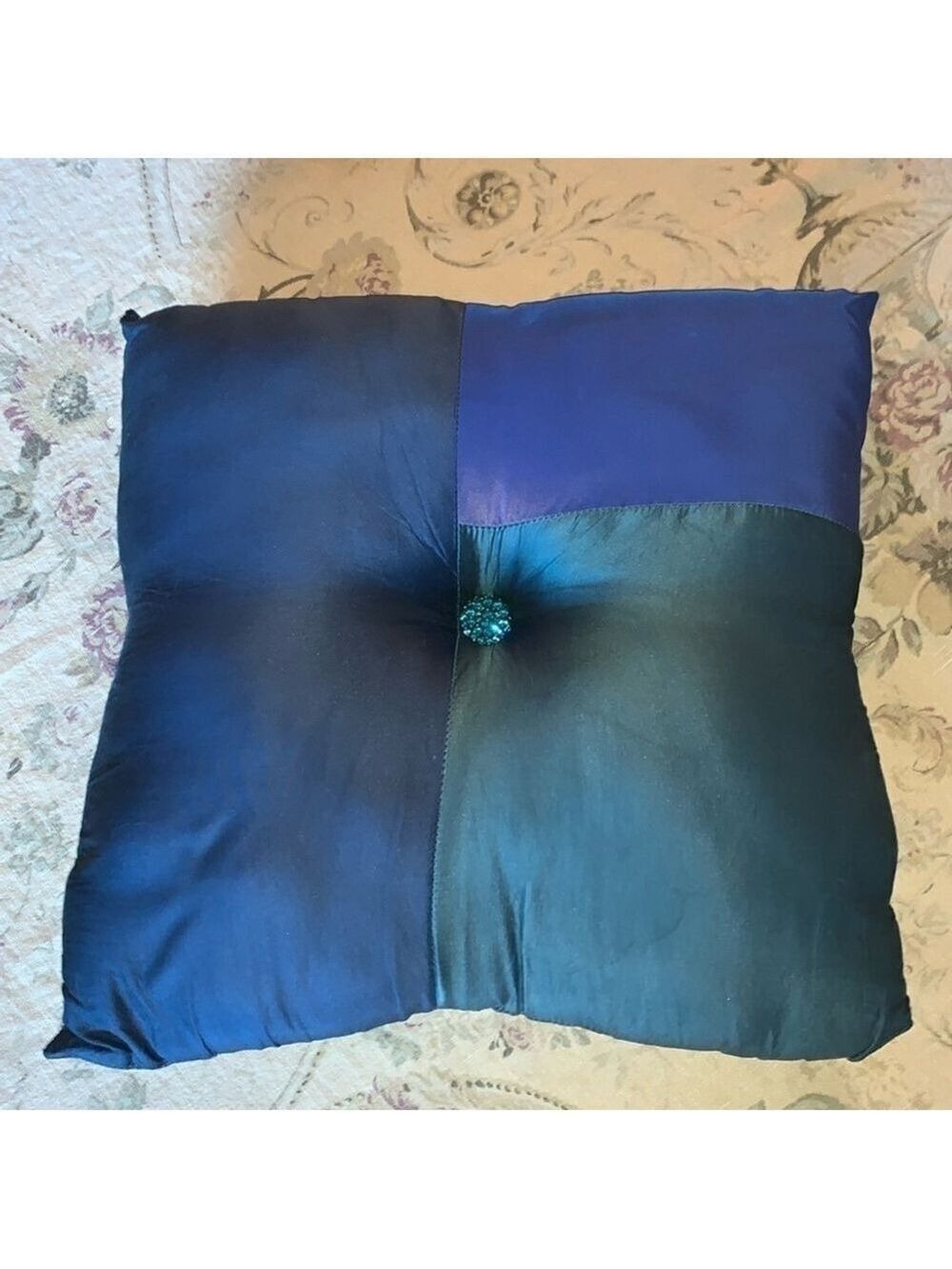 Blue tone shiny decorative throw pillow with bedazzled buttons